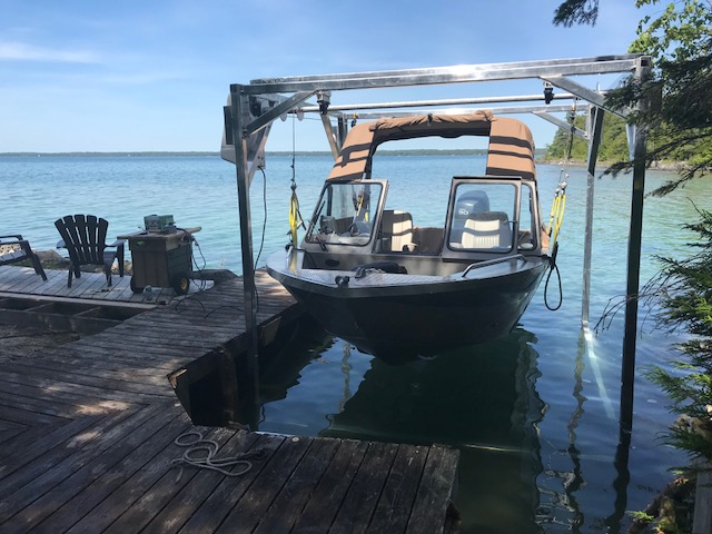 Boat suspended with shallow water boat lift